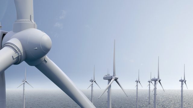 Wind park on ocean with blue sky